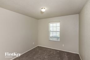 Converse house for rent - the upstairs bedroom with carpet and a window