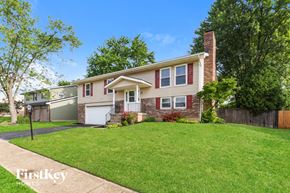 Dayton house for rent - a house with a lawn and a sidewalk in front of it
