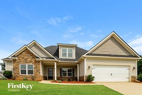 Gainesville house for rent - A house with a garage and a driveway is shown.