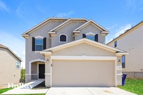 San Antonio house for rent - A two-story house with a garage and a driveway.