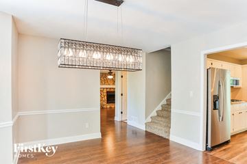 Hiram house for rent - a kitchen and living room with a refrigerator and a chandelier