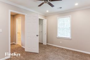 Hiram house for rent - an empty bedroom with a ceiling fan and a closet