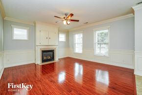 Dublin house for rent - A room with a fireplace and wooden floors.