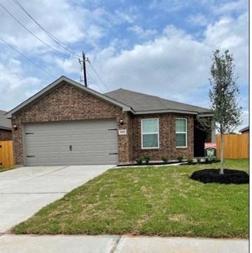 Richmond house for rent - a brick house with a gray garage door