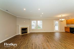 Camby house for rent - the living room with wood flooring and a fireplace
