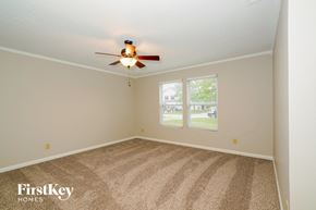 Camby house for rent - the master bedroom has a carpeted floor and a ceiling fan