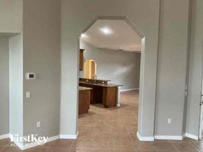 Englewood house for rent - a hallway with a dining room and a kitchen