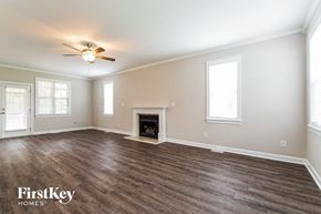 Raleigh house for rent - the living room with wood flooring and a fireplace