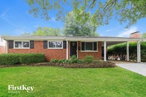 Kirkwood house for rent - a small brick house with a lawn in front of it