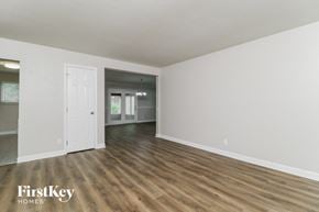 Kirkwood house for rent - an empty living room with white walls and wood floors
