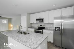 Kannapolis house for rent - a kitchen with granite counter tops and stainless steel appliances