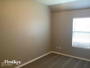 Rhome house for rent - a bedroom with a window and a wooden floor
