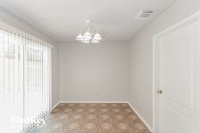 San Antonio house for rent - A room with a tiled floor and a door.