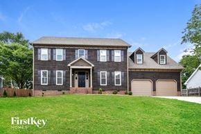 High Point house for rent - a large house with a lawn in front of it