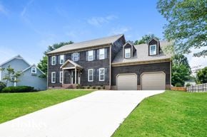 High Point house for rent - a large house with a garage and a driveway
