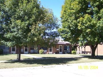 Carroll apartment for rent - a brick building with trees in front of it