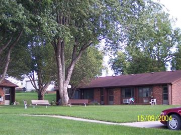 Carson apartment for rent - a house with a red car parked in the yard