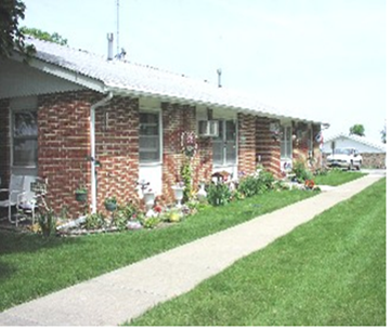 Shelby apartment for rent - a brick house with a sidewalk in front of it