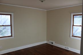 Spartanburg apartment for rent - an empty room with wooden floors and two windows