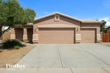 San Tan Valley house for rent - a house with a driveway and a garage door