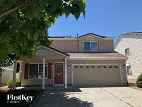 Denver house for rent - a white house with a red door and a tree