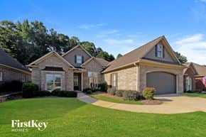 Trussville house for rent - A large house with a driveway in front of it.