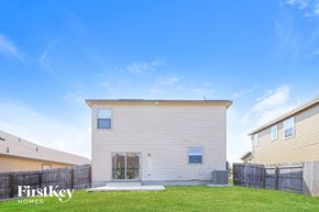 San Antonio house for rent - the exterior of a white house with a grassy yard