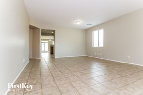 Laveen house for rent - a large empty living room with tile flooring