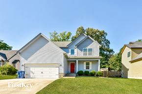 Clarksville house for rent - a white house with a red door and a lawn
