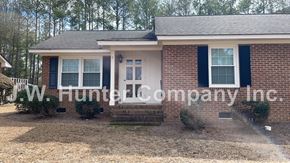 Wilson apartment for rent - A house with a sign that says W.J. Hunter Company Inc.