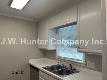 Wilson apartment for rent - A kitchen with a sink and a window.