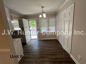 Wilson apartment for rent - A room with wood flooring and white walls, with a sign that reads "J.W. Hunter Company Inc."