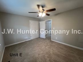 Wilson apartment for rent - A room with a ceiling fan and carpeted floor.