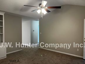 Wilson apartment for rent - A room with a ceiling fan and carpeted floor.
