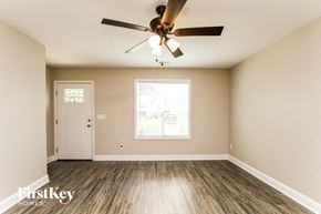 Concord house for rent - A room with a ceiling fan and a window.