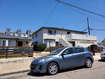 National City apartment for rent - a car parked on the street in front of a house