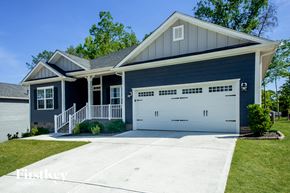 Locust house for rent - a blue house with a white garage door