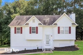 Temple house for rent - a white house with red shutters and a lawn and trees
