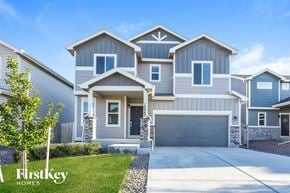 Colorado Springs house for rent - A row of houses with the first one being a two story house with a garage.