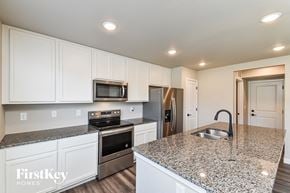 Colorado Springs house for rent - A kitchen with granite countertops and stainless steel appliances.