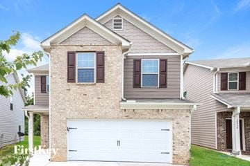 Hampton house for rent - a house with a white garage door in front of it