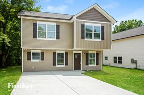 Concord house for rent - a tan and with a driveway
