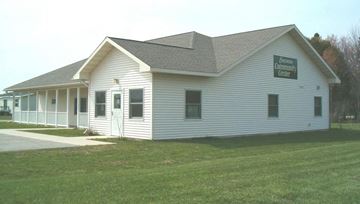 Escanaba apartment for rent - a white building with a sign on the side of it