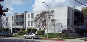 Los Angeles apartment for rent - a white car parked in front of an apartment building