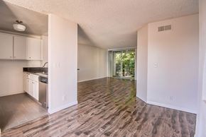 Los Angeles apartment for rent - an empty kitchen and living room with a wood floor