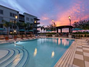 Savannah apartment for rent - a swimming pool at dusk at the resort at longboat key club