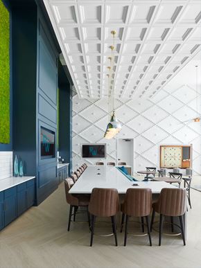 Savannah apartment for rent - a dining room with a long white table and chairs and a blue wall and ceiling
