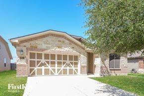 San Antonio house for rent - A house with a garage door that has a diamond pattern.