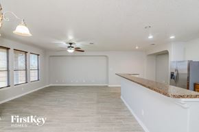 San Antonio house for rent - A spacious room with a ceiling fan and a countertop.