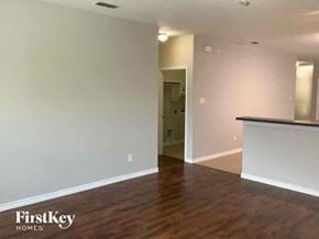 Little Elm house for rent - an empty living room with white walls and wood floors